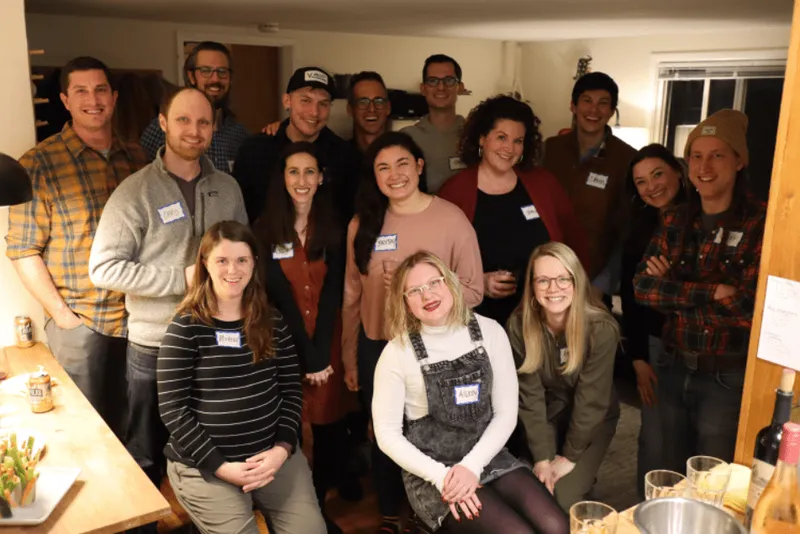 a group of people wearing name tags at a party