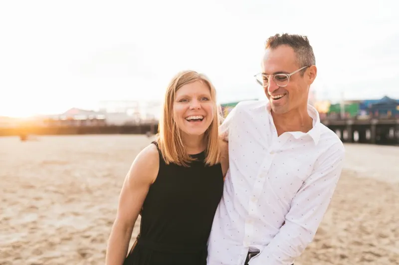 a photo of a woman and man in the beach