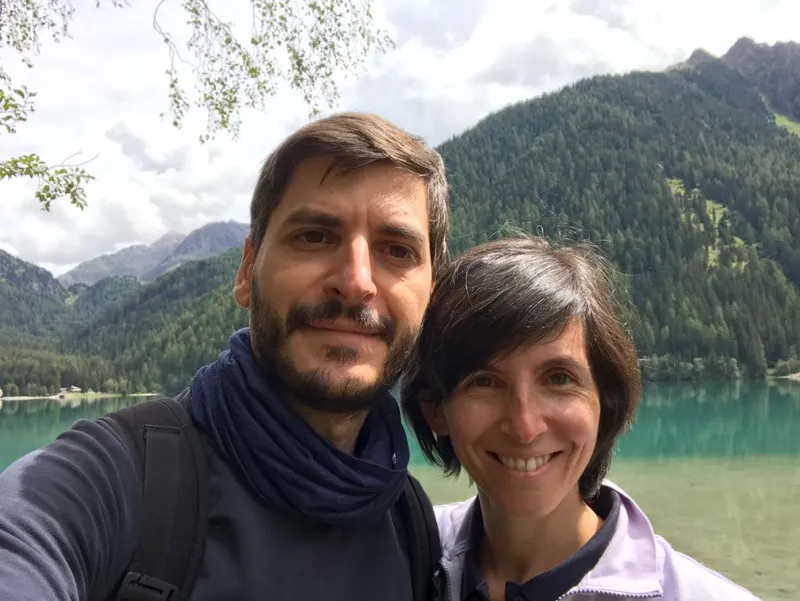 man and woman smiling outdoors