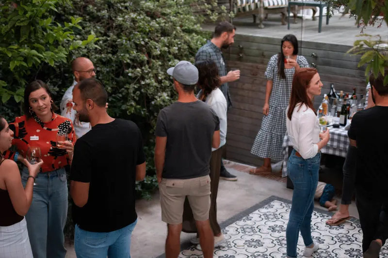 people talking with each other at a party