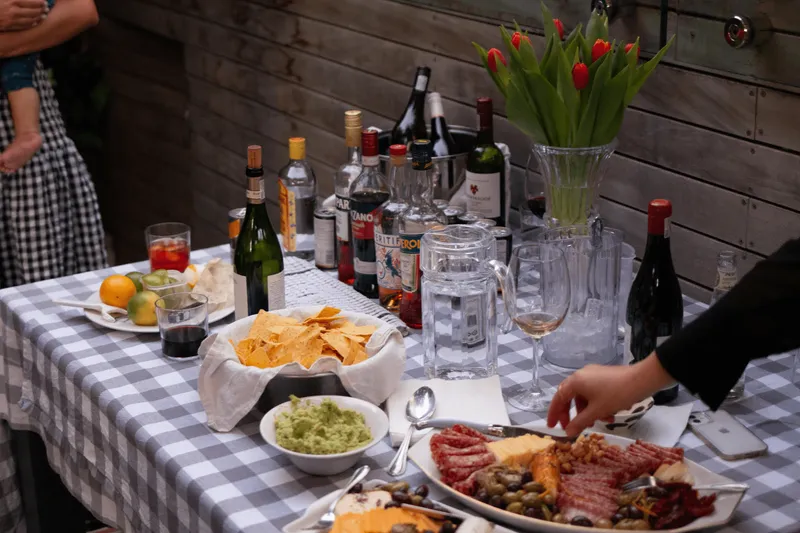 photo of snacks, guacamole, fruits, and alcohols