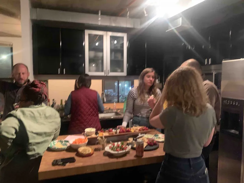 Lauren's party guests around her kitchen.