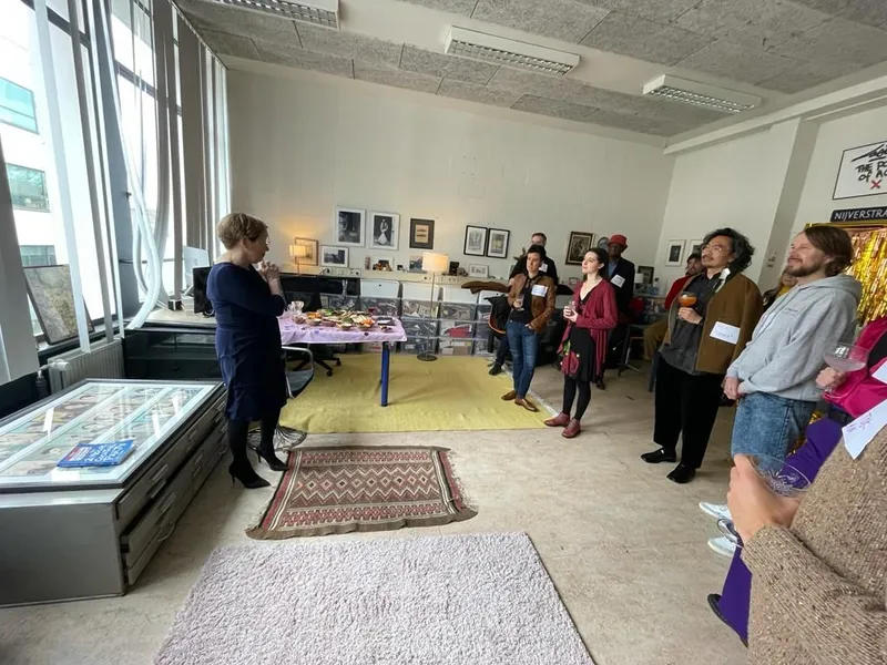 group of people talking in a big room