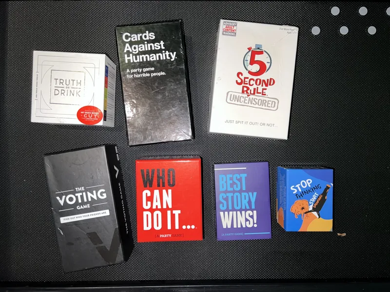 Assorted icebreaker card decks and party games for conversation starters