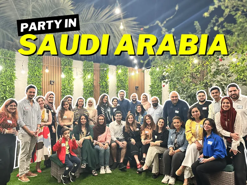 Header text: Party in Saudi Arabia, with a group photo from Sarah's happy hour