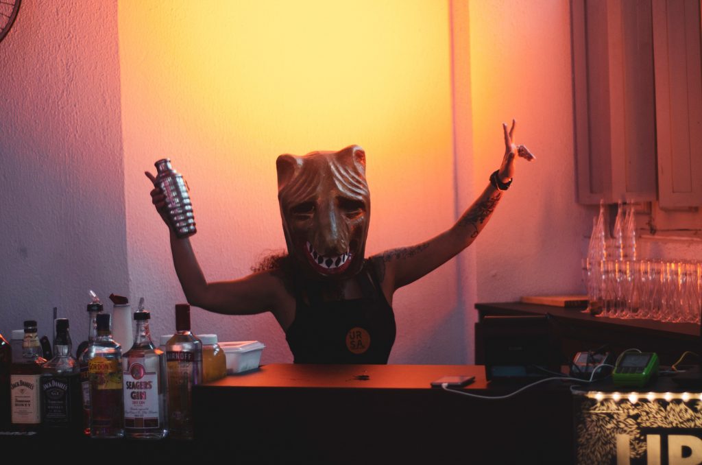 FeaturedImage Pexels person wearing mask holding cocktail shaker 1230397