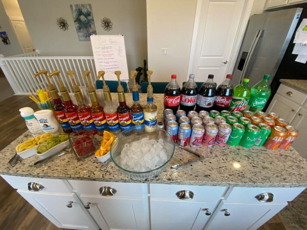 photo of Torani syrups, soda, ice, fruits, and seltzers