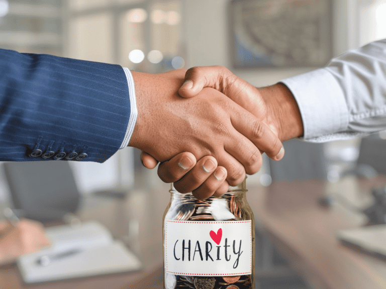 2 arms sealing a deal with a jar labelled as "Charity"